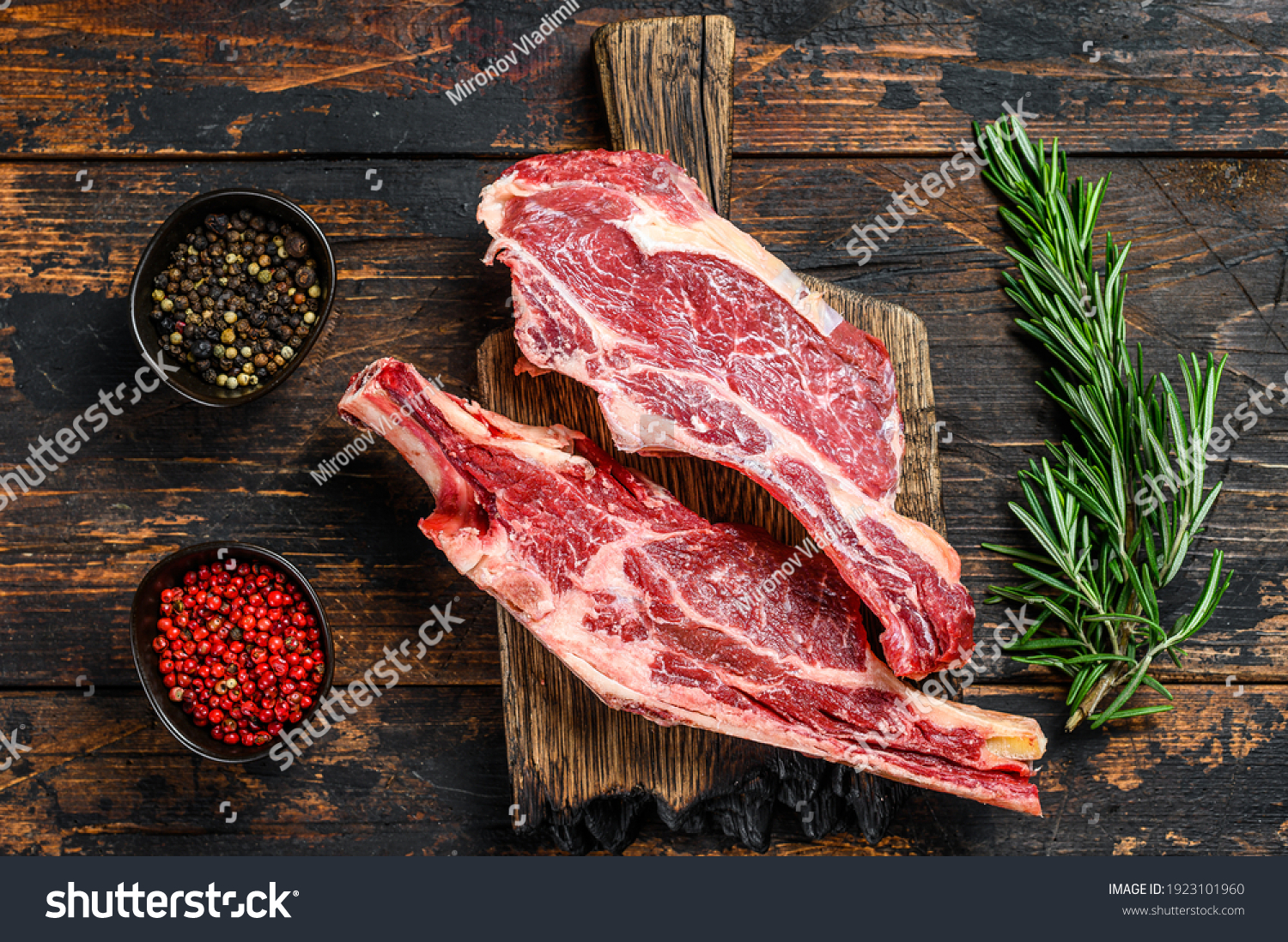 Stock Photo Fresh Cuts Of Raw Beef Meat On A Cutting Board Dark Wooden Background Top View 1923101960